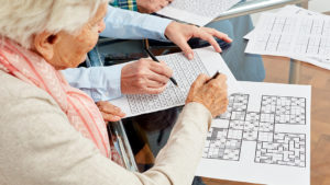 Seniors working on crossword puzzles
