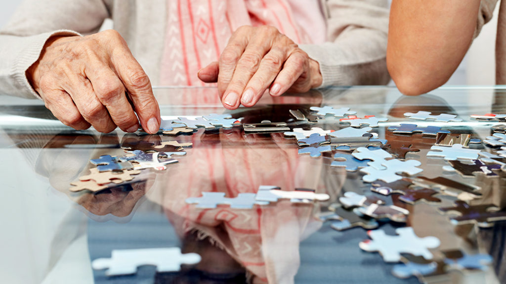 Seniors putting a puzzle together